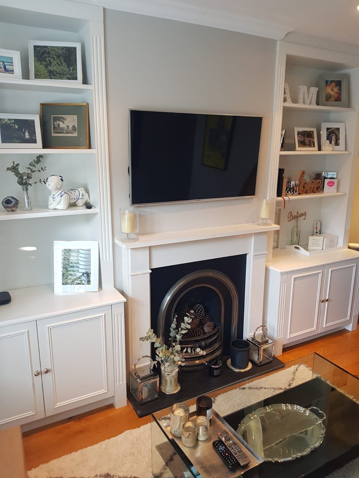 Sitting room after Signature Touch presentation: repainted alcove shelving, styled fireplace and fresh accents